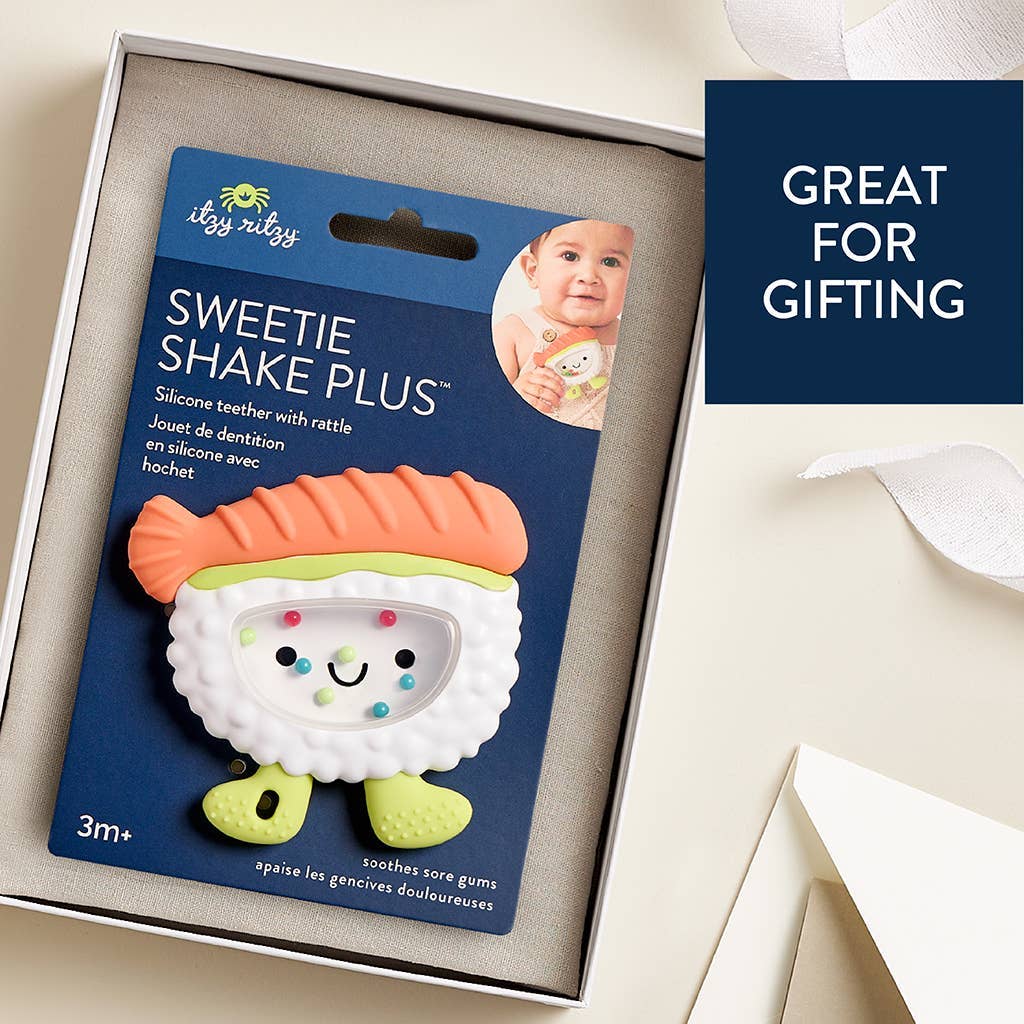Silicone teether packaging with branding and product details on a beige background