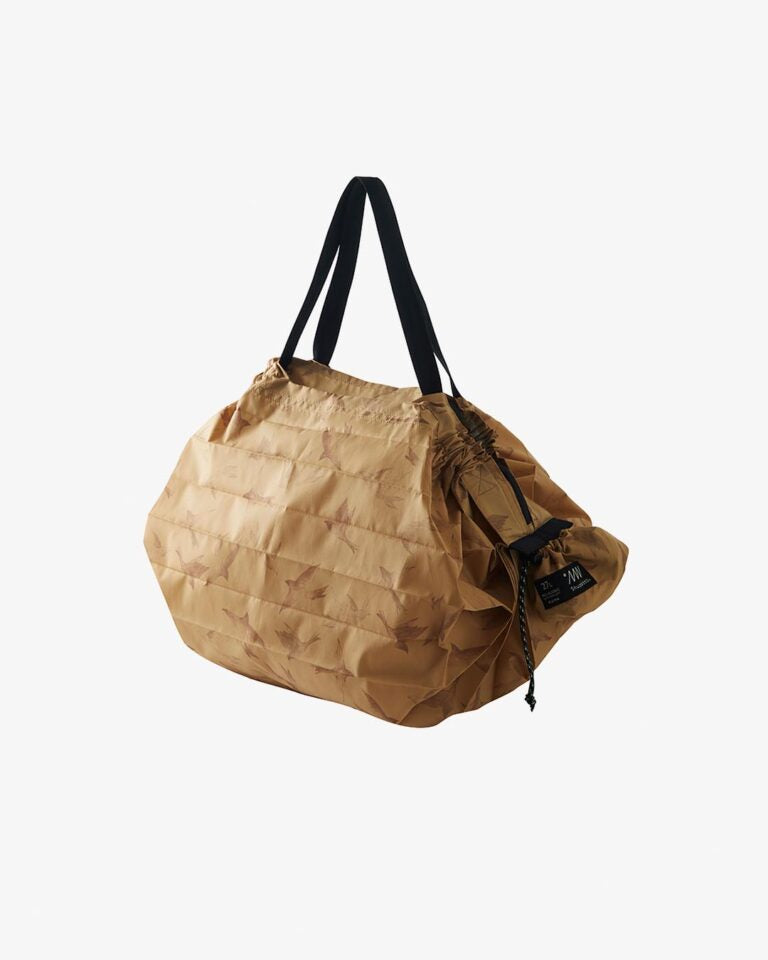 Brown paper bag with black handles on a white background