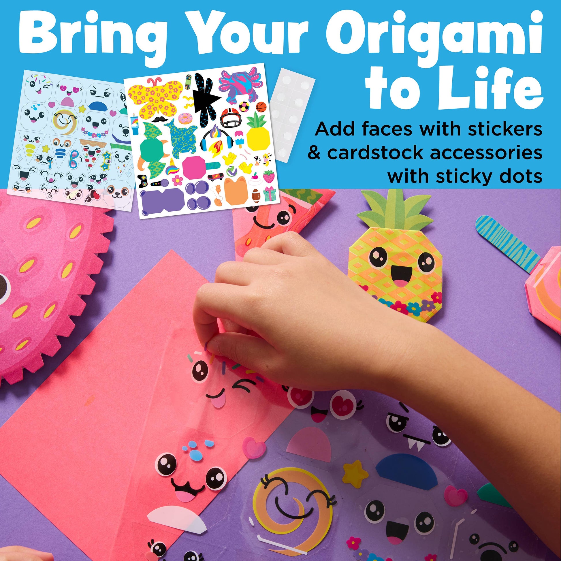 Children's origami kit with colorful paper, stickers, and cardstock accessories on a purple background.