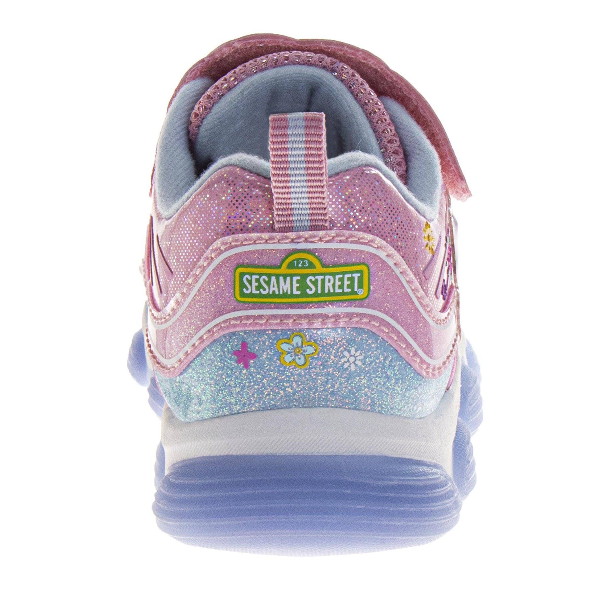 Pink Sesame Street shoe with a visible brand logo on a white background