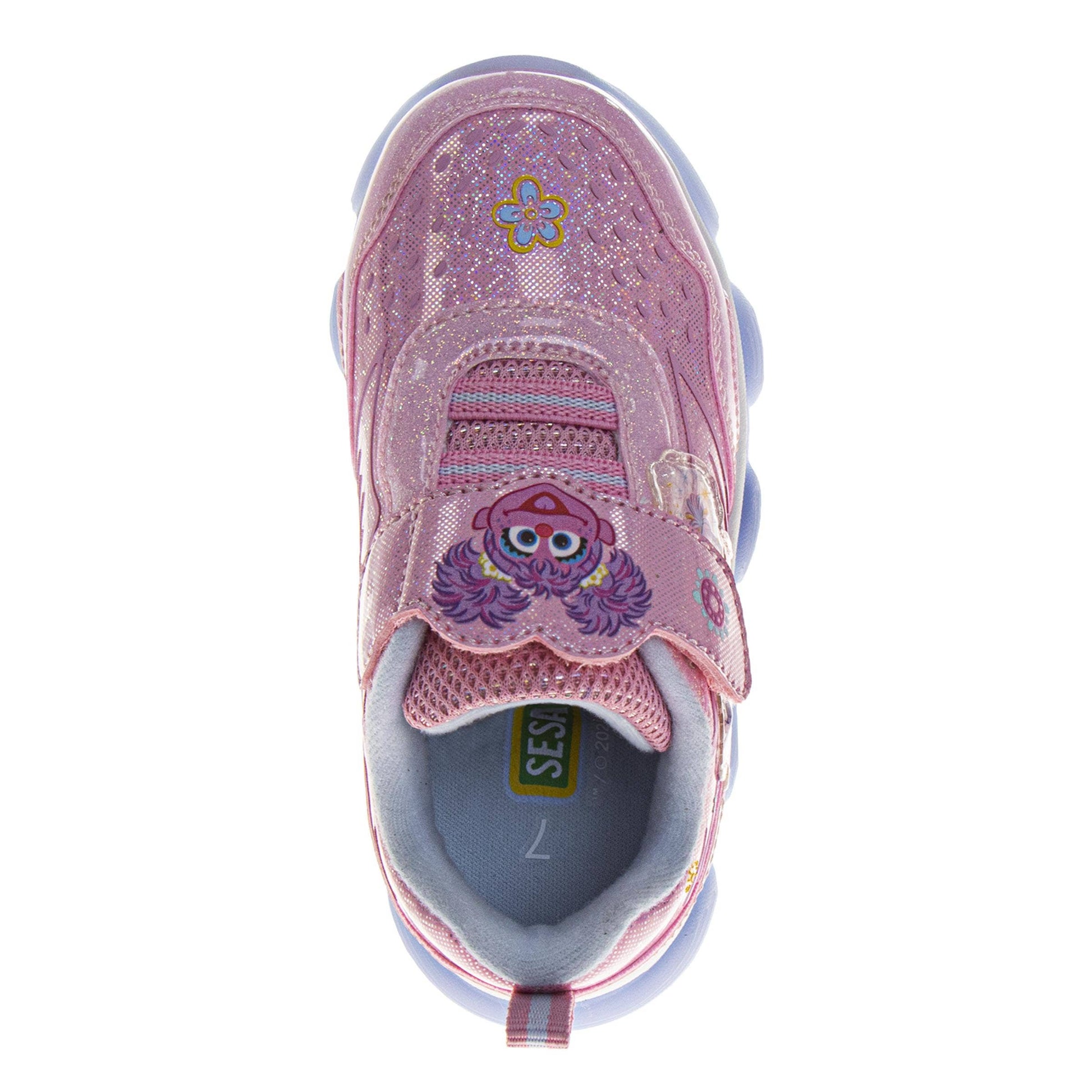 Pink children's shoe with a character design on a white background