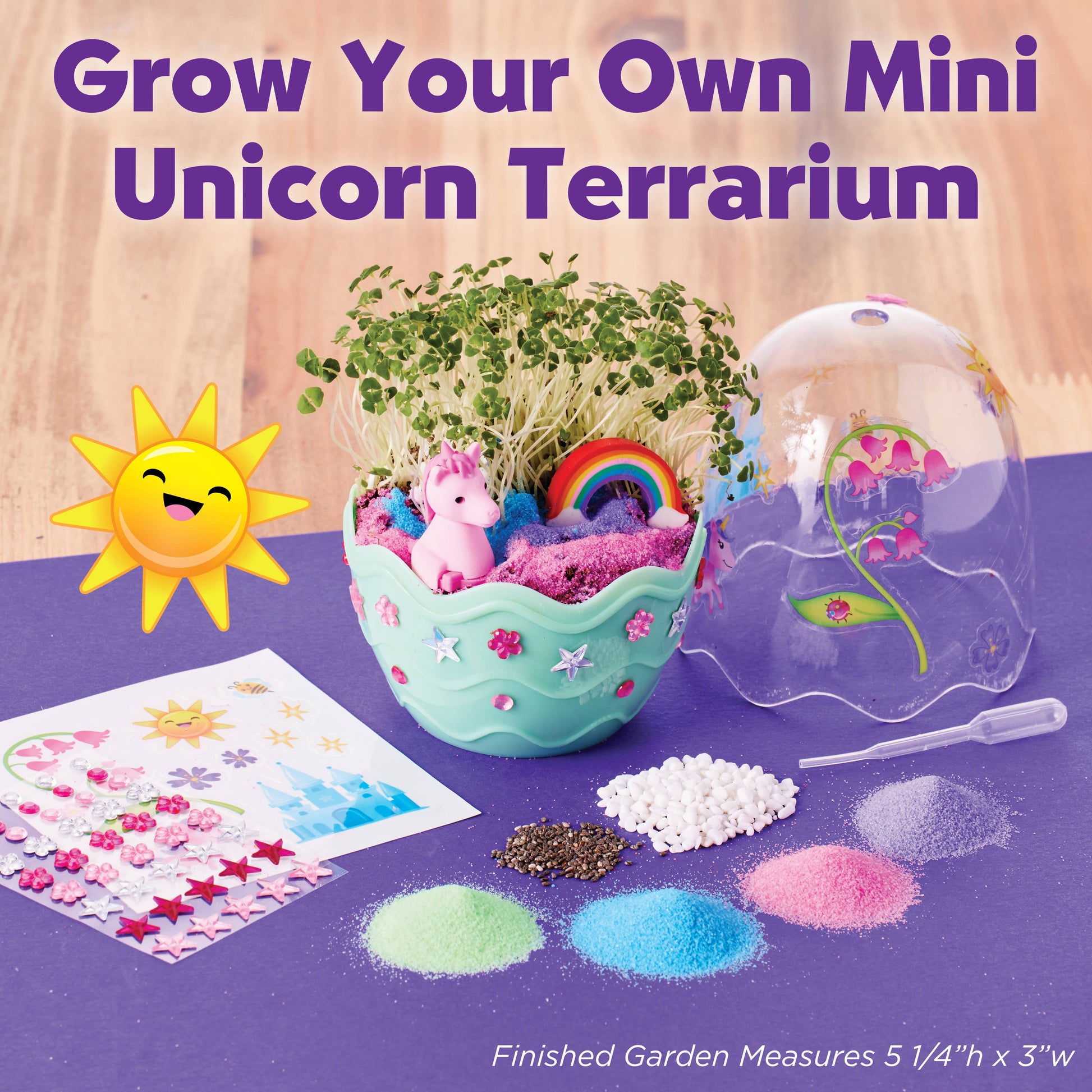 Unicorn terrarium kit with materials and tools on a purple surface, featuring text 'Grow Your Own Mini Unicorn Terrarium'.